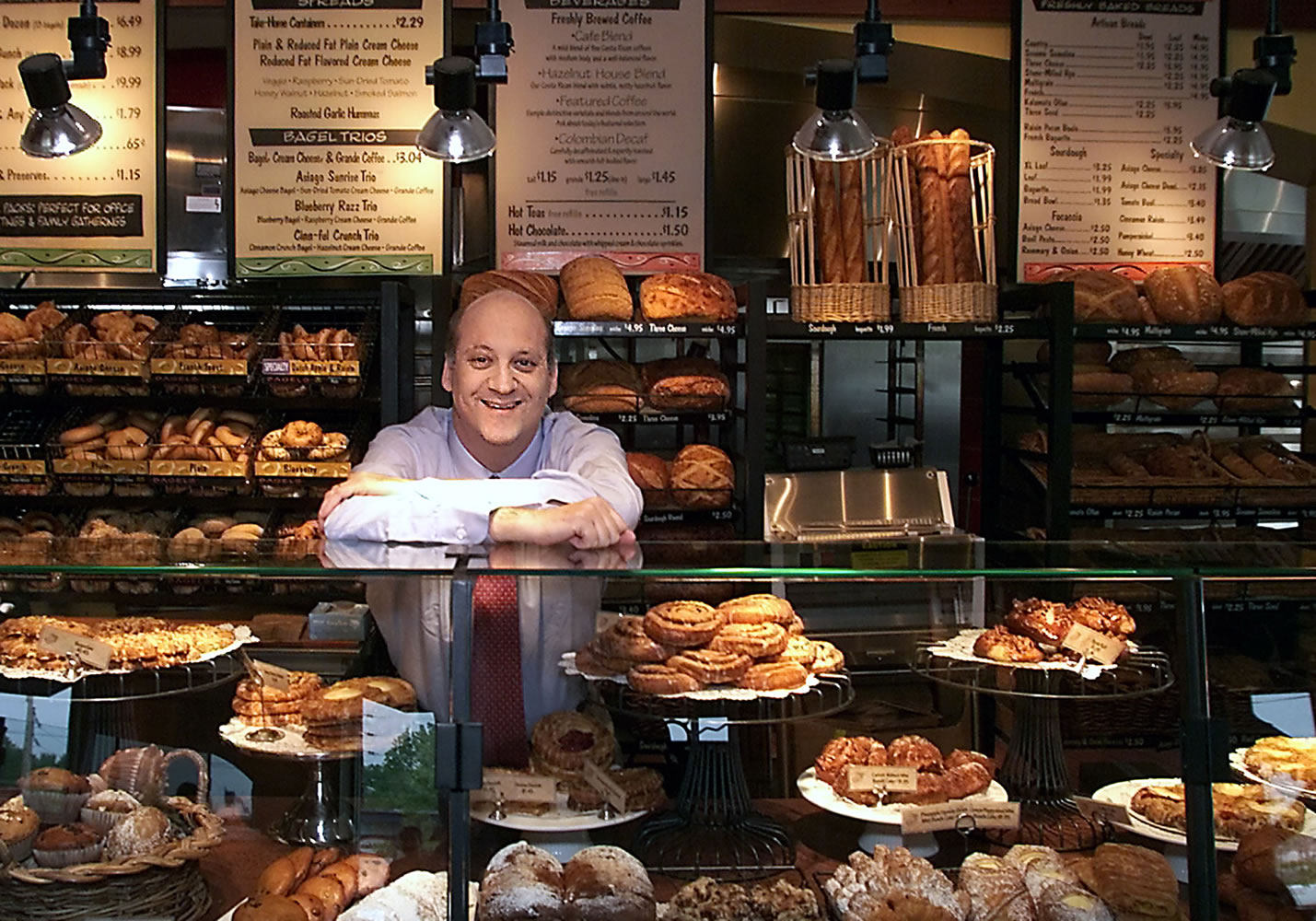 Panera Bread Co. CEO Ron Shaich stands behind a counter at a location in St. Louis.