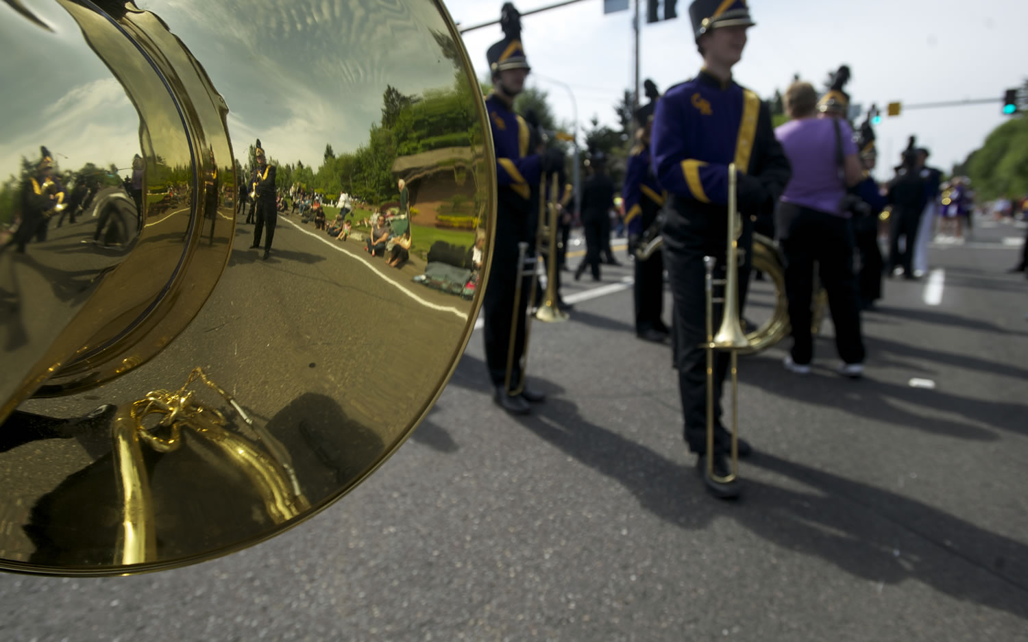 Members of Columbia River's band are reflected in sophomore Michael Hall's sousaphone before the start of the 48th annual Hazel Dell Parade of Bands in 2012.