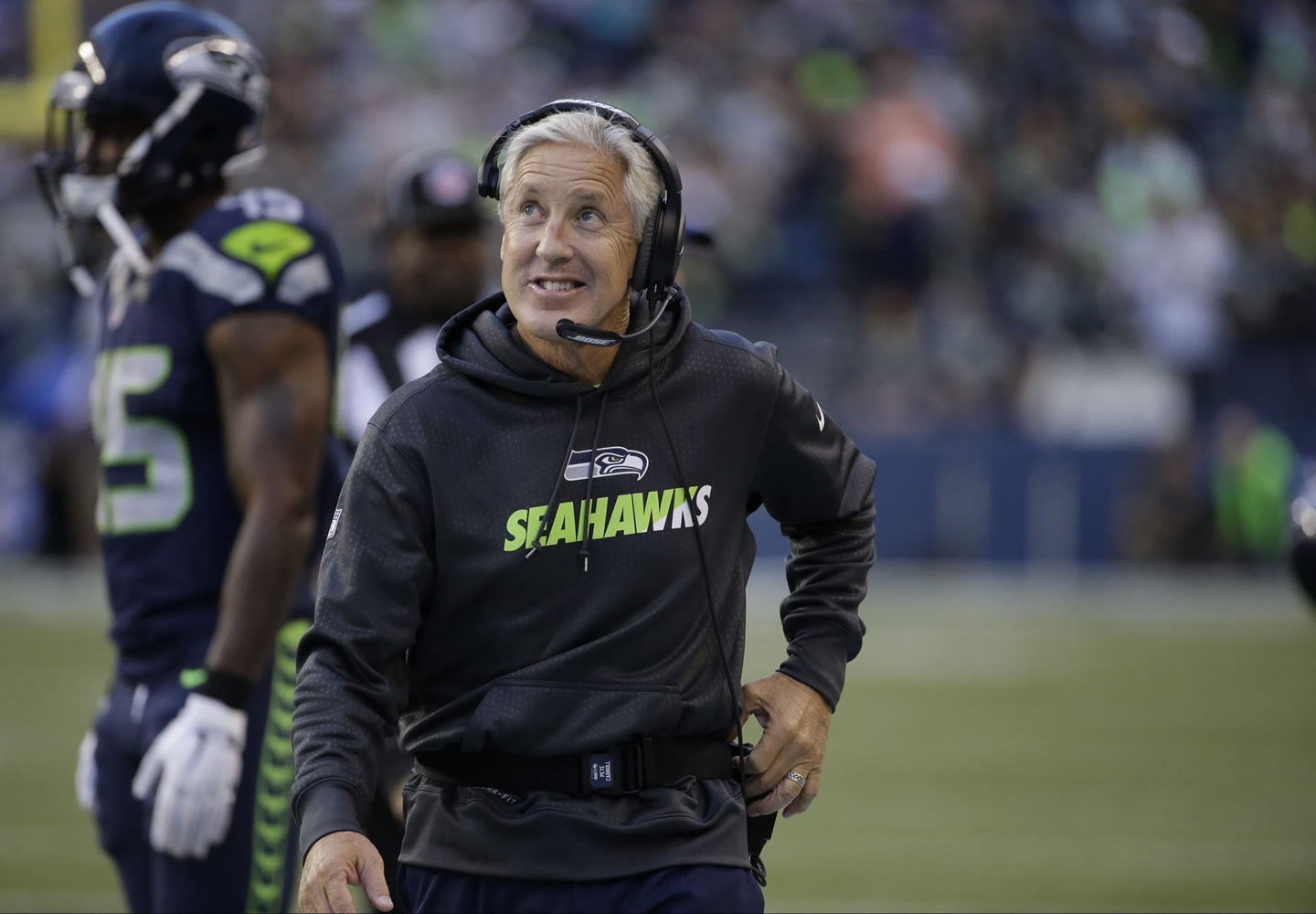 Seattle Seahawks head coach Pete Carroll smiles on the sidelines during in the first half of a preseason NFL football game against the Oakland Raiders, Thursday, Sept. 3, 2015, in Seattle.