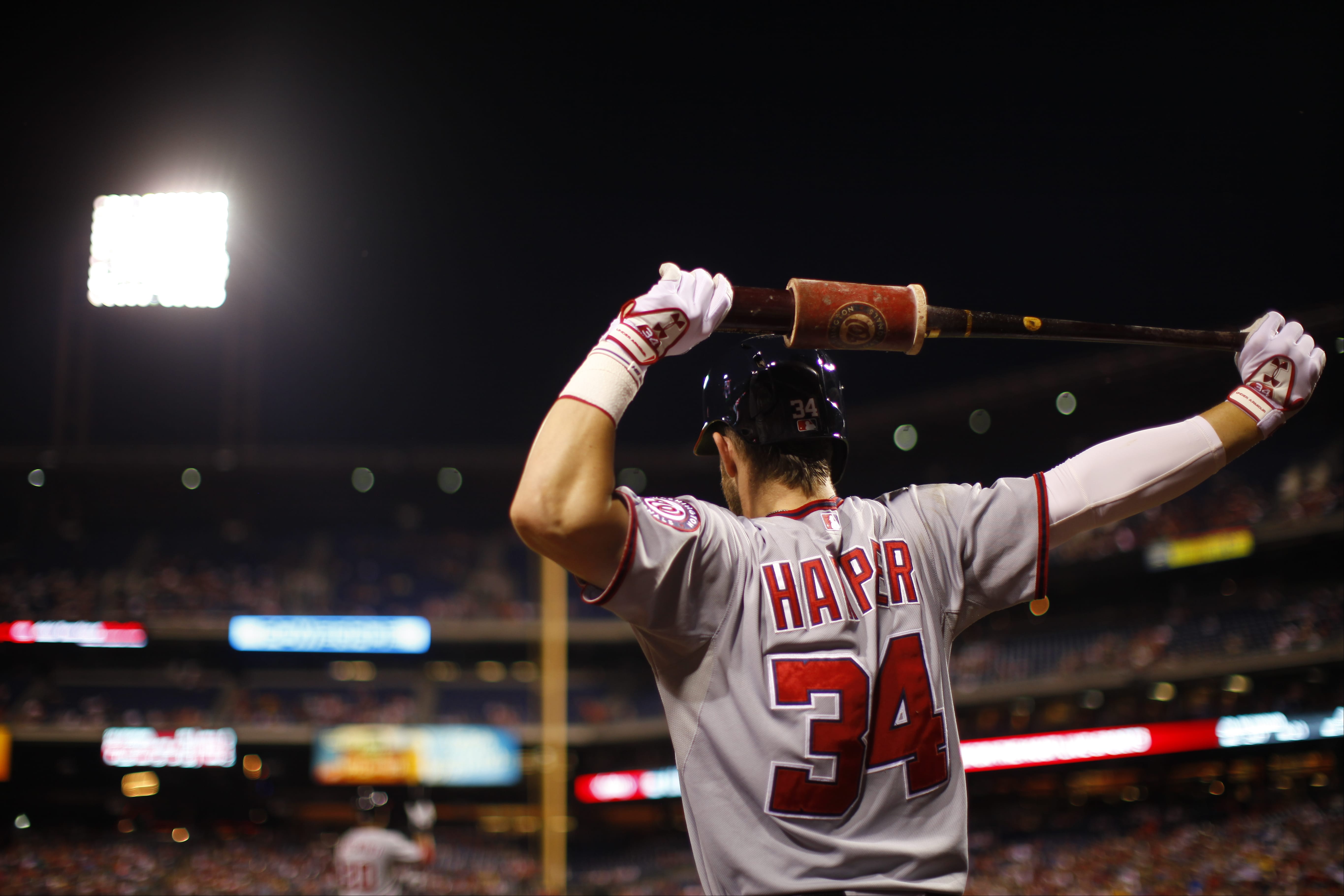 Washington Nationals' Bryce Harper prepares to bat during a baseball game against the Philadelphia Phillies in Philadelphia. The final month of the season offers a chance for redemption for Harper.