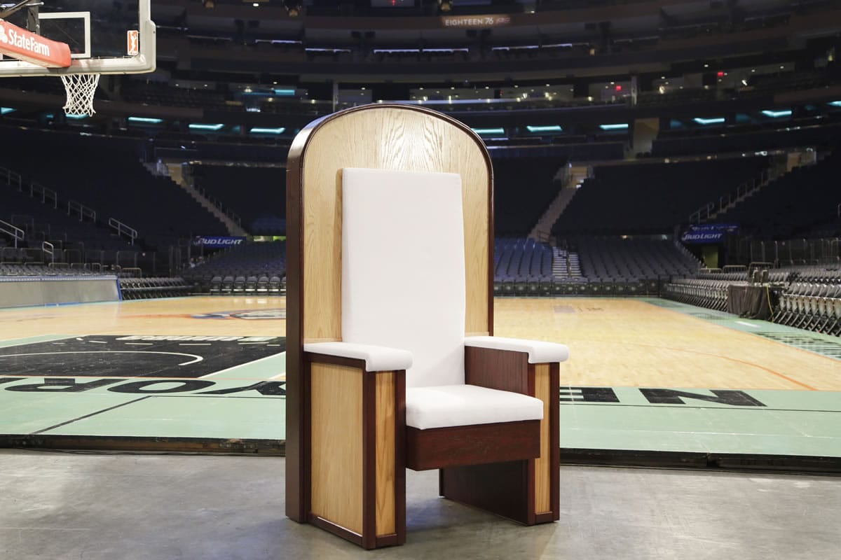 The Pope's chair is unveiled during a media event at New York's Madison Square Garden, Wednesday, Sept. 2, 2015. The simple wooden chair has been built for Pope Francis when he celebrates Mass at the sports and entertainment arena on Friday, Sept. 25.