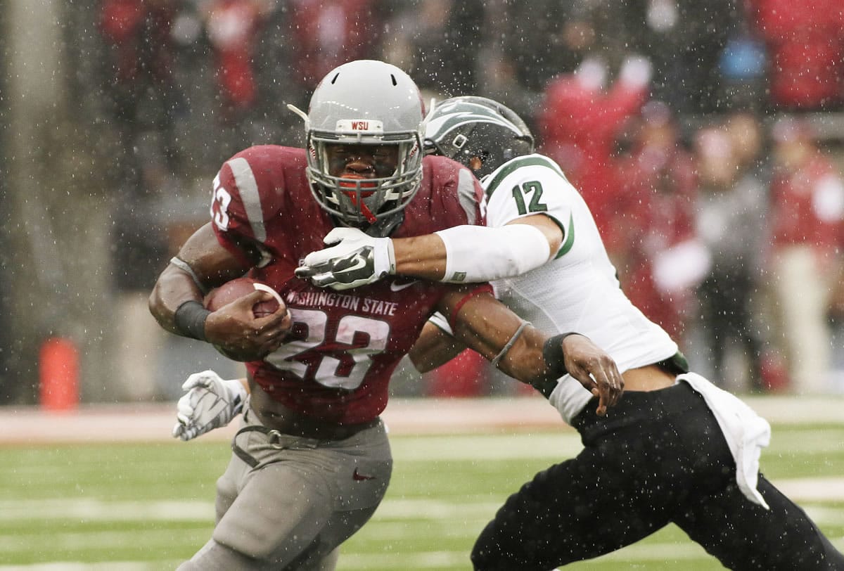Washington State running back Gerard Wicks (23) runs against Portland State safety Walter Santiago (12) during the first half of an NCAA college football game, Saturday, Sept. 5, 2015, in Pullman, Wash.