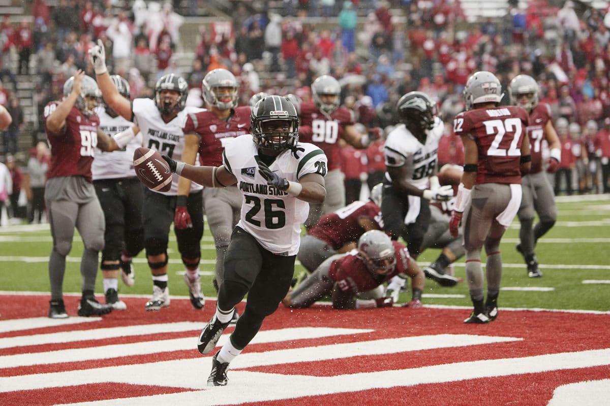 Portland State running back Steven Long (26) celebrates his touchdown against Washington State during the second half of an NCAA college football game, Saturday, Sept. 5, 2015, in Pullman, Wash. Portland State won 24-17.