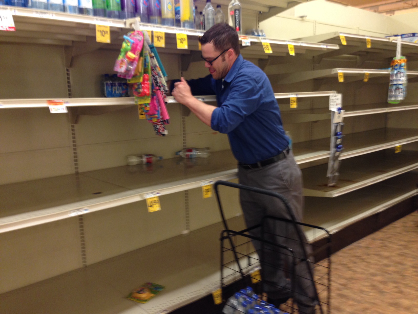 Matt Smith purchases some of the last bottled water available Friday at a Safeway store in Portland. A citywide boil notice was issued Friday for Portland, after E.