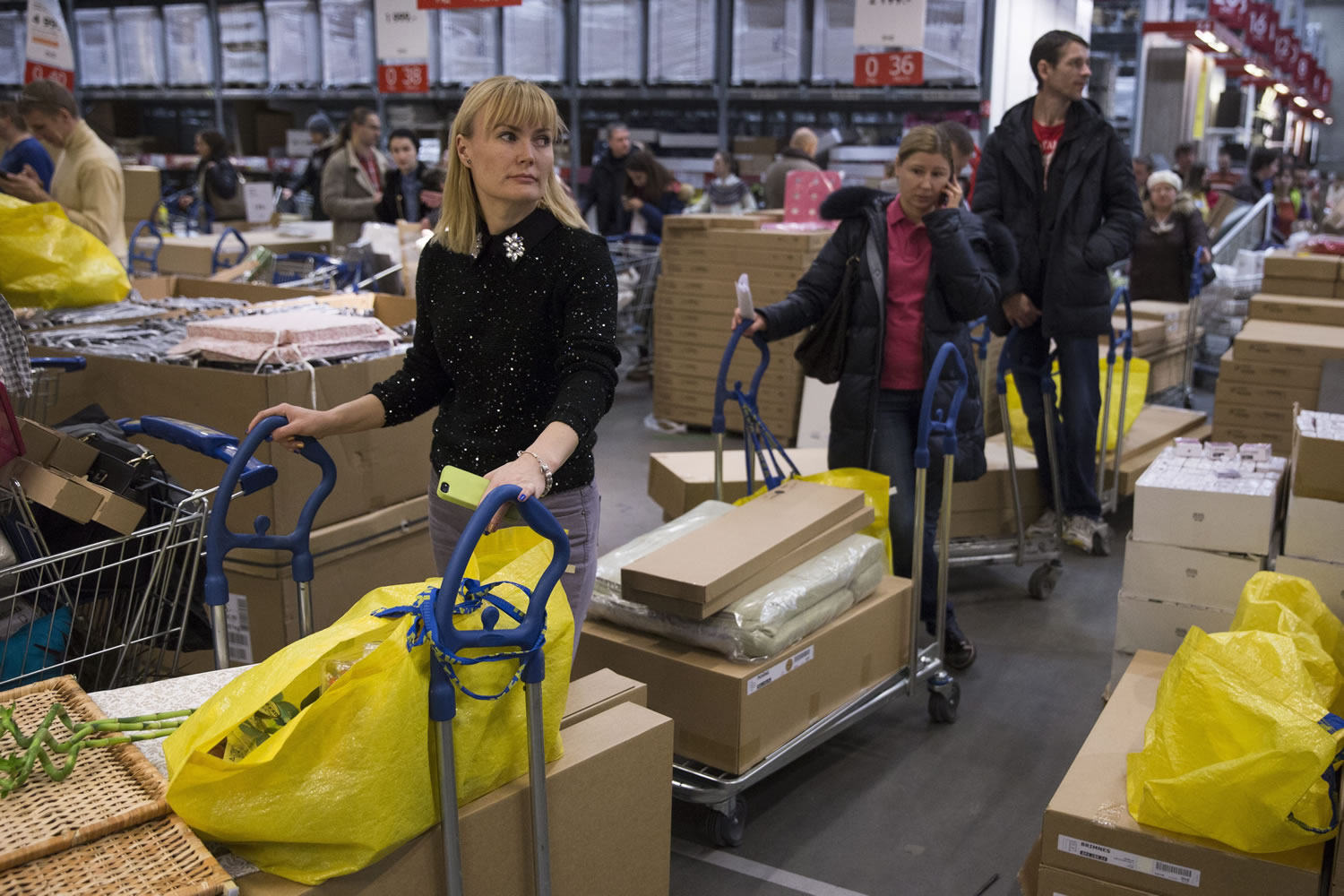 People wait in a checkout line Wednesday at the Ikea store on the outskirts of Moscow.