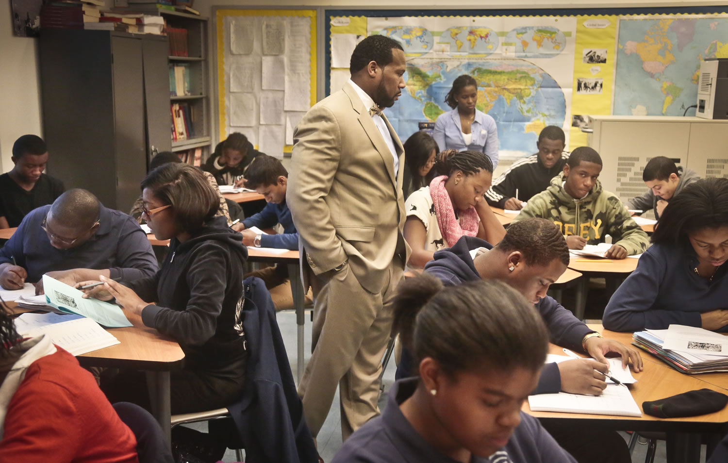 Adofo Muhammad, center, principal of Bedford Academy High School, teaches 10th and 11th graders in his Global Studies class in the Brooklyn Borough of New York in December. New York state has the most segregated public schools in the nation, with many black and Latino students attending schools with virtually no white classmates, according to a report released Wednesday, March 26, 2014, by the Civil Rights Project at the University of California at Los Angeles.