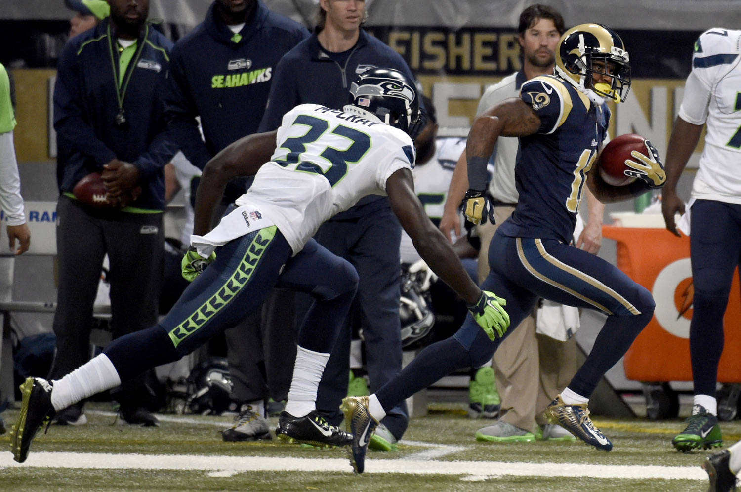 St. Louis Rams' Tavon Austin, right, returns a put 75-yards for a touchdown past Seattle Seahawks safety Kelcie McCray during the third quarter of an NFL football game Sunday, Sept. 13, 2015, in St. Louis. (AP Photo/L.G.