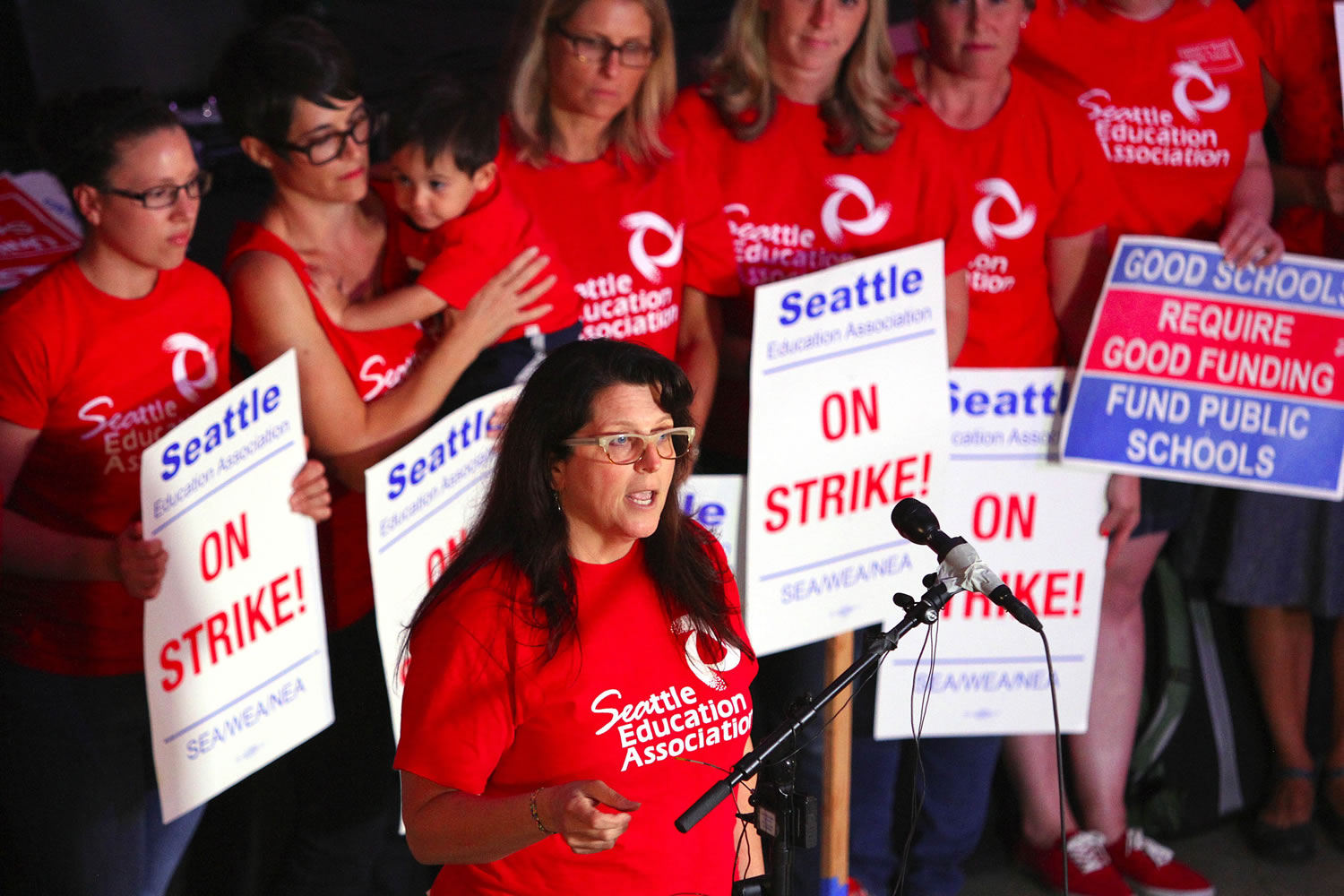 Phyllis Campano, vice president of the Seattle Education Association, addresses the media during an update of negotiations Sunday, Sept. 13, 2015, in Seattle. Seattle Public Schools is canceling classes for a fourth day Monday as a strike by teachers enters its second week.
