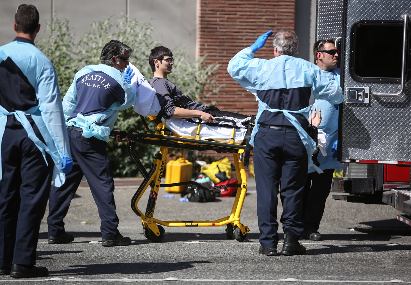 Jon Meis is taken from the shooting scene by medics Thursday at Seattle Pacific University.