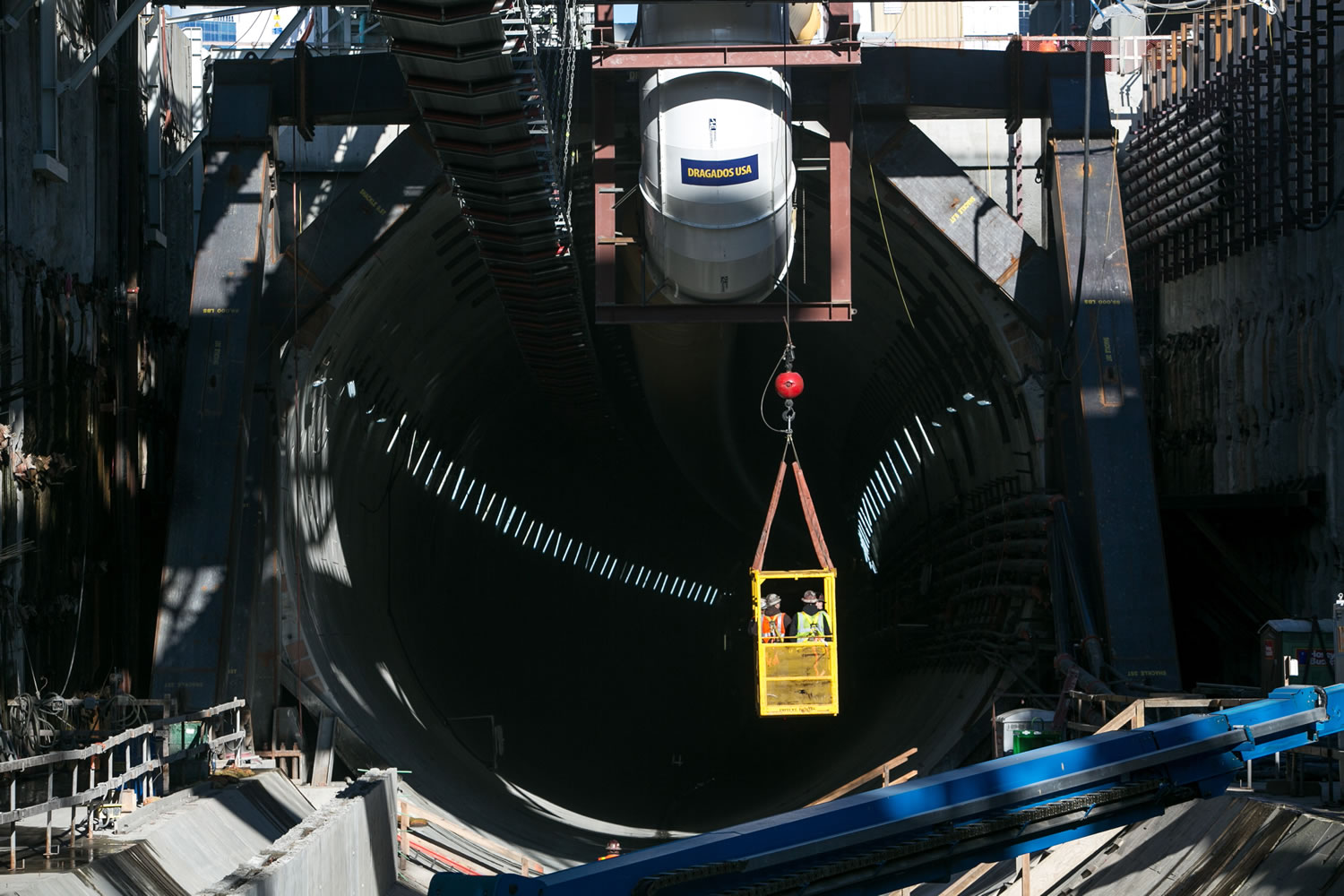 Workers are lifted from the launch pit of Seattle's waterfront tunnel boring machine on Jan.