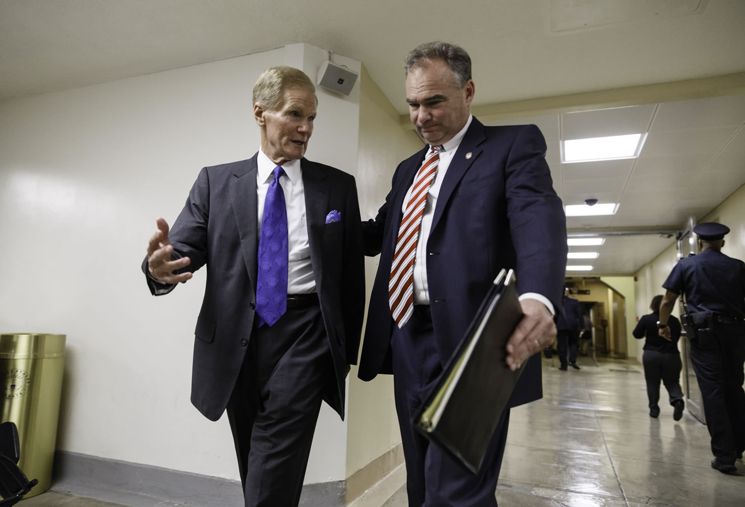 Bill Nelson, D-Fla., left, and Sen. Tim Kaine, D-Va., right, leave the Senate after a series of votes to confirm federal judicial appointees at the Capitol in Washington on Tuesday, June 3, 2014.