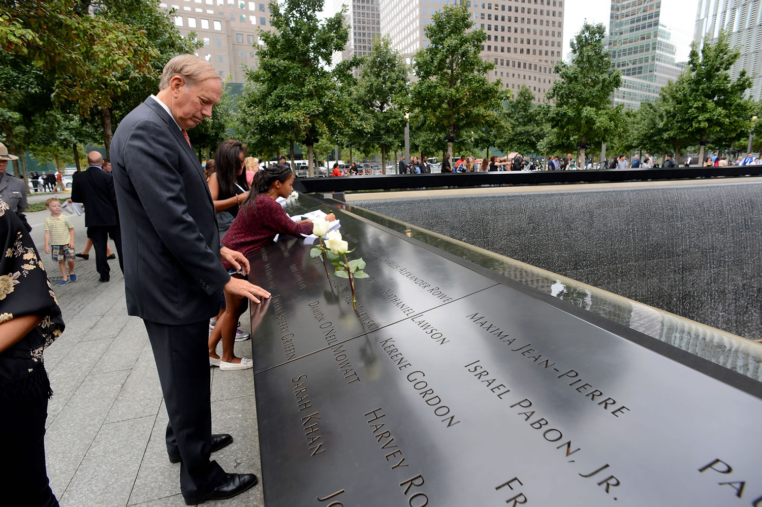 Former New York Gov. George Pataki visits the North Pool during memorial observances Thursday on the 13th anniversary of the Sept. 11 terror attacks on the World Trade Center in New York.