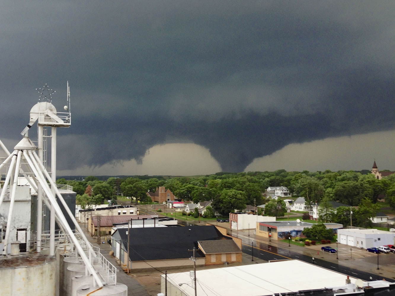 This photo taken on Monday from atop the Wisner, Neb., grain elevator shows a tornado approaching Pilger, Neb.