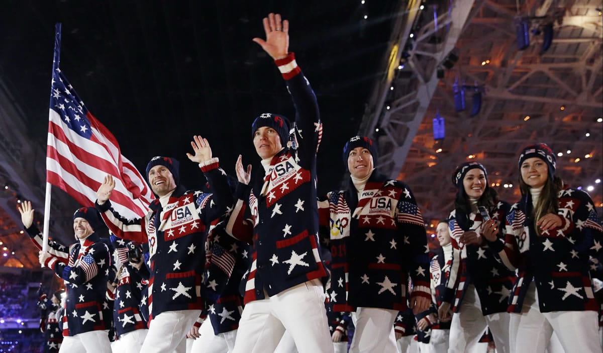 The United States team arrives during the opening ceremony of the 2014 Winter Olympics on Feb. 7 in Sochi, Russia. Ralph Lauren's love for the American flag and American style earned him high honors Tuesday from the Smithsonian Institution, celebrating his five decades in fashion. Lauren designed the uniforms for the team.