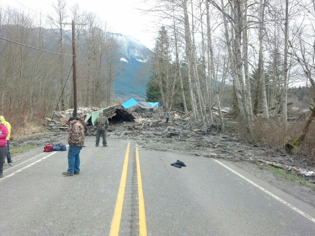This photo provided by the Washington State Patrol shows the aftermath of a mudslide that moved a house with people inside in Snohomish County on Saturday March 22, 2014. The Washington Department of Transportation says mud, trees and building materials are blocking both directions of State Route 530 near the town of Oso. Search and rescue operations are underway by Snohomish County crews and the Washington State Patrol. Spokesman Bart Treece of the Washington State Department of Transportation says he doesn't know how long the two-lane rural road will be closed. He says drivers are advised to find another way to get between Darrington and Arlington.