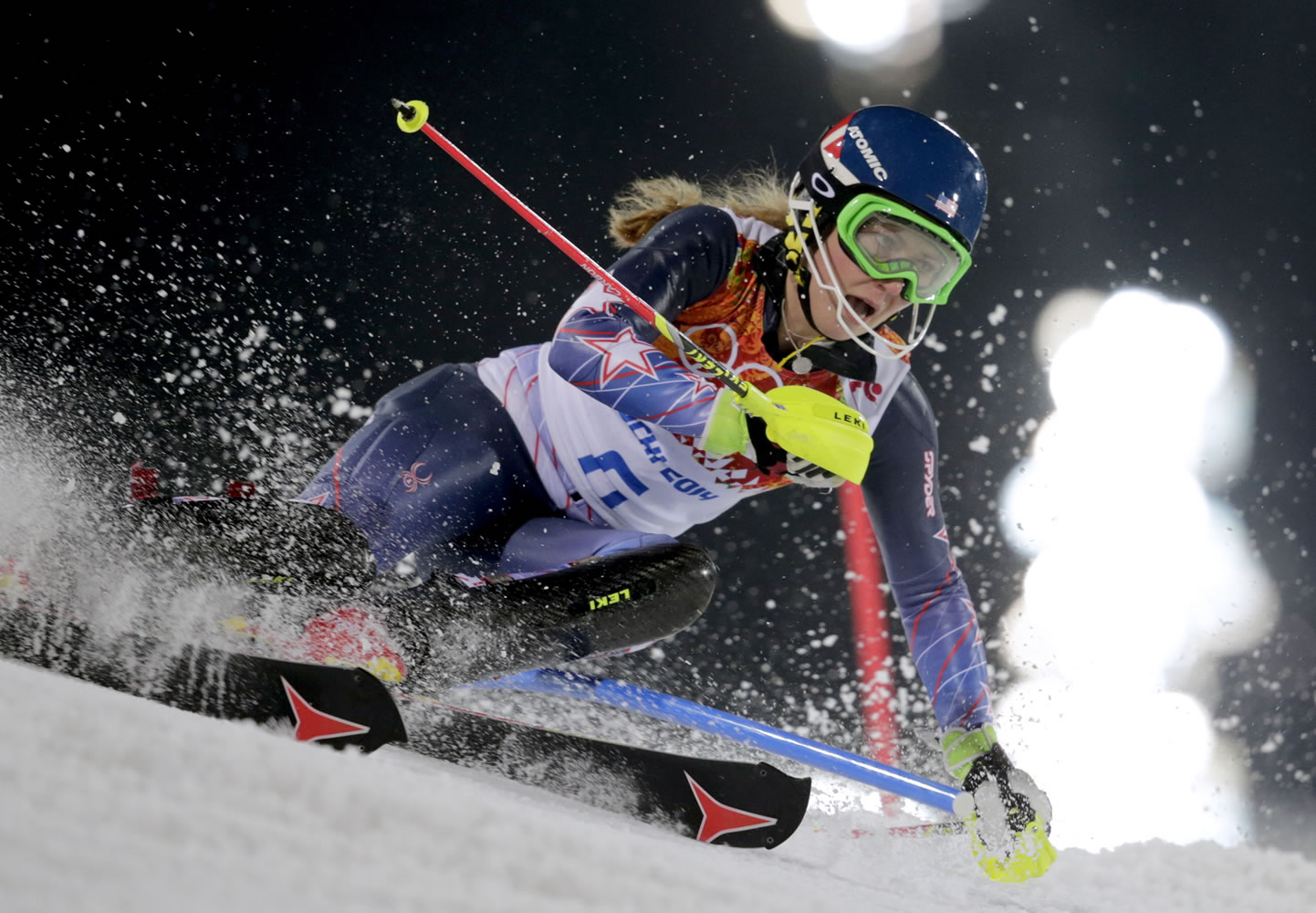 Gold medal winner Mikaela Shiffrin skis past a gate in the women's slalom at the Sochi 2014 Winter Olympics on Friday in Krasnaya Polyana, Russia.