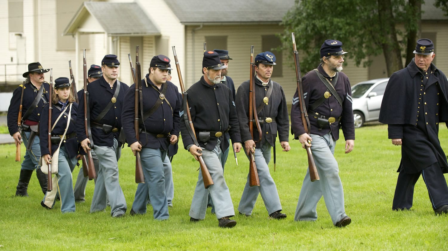 1st Oregon Volunteer Infantry re-enactors march in formation during a soldiers bivouac demonstration at the Vancouver Barracks on May 27, 2013.