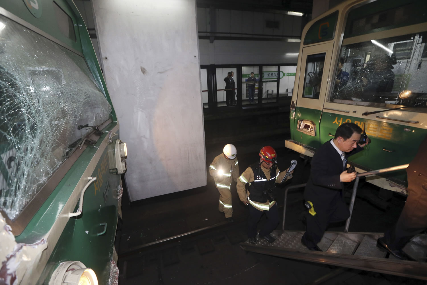 Windows of two subway trains remain broken after their collision at Sangwangshipri subway station in Seoul, South Korea, on Friday.