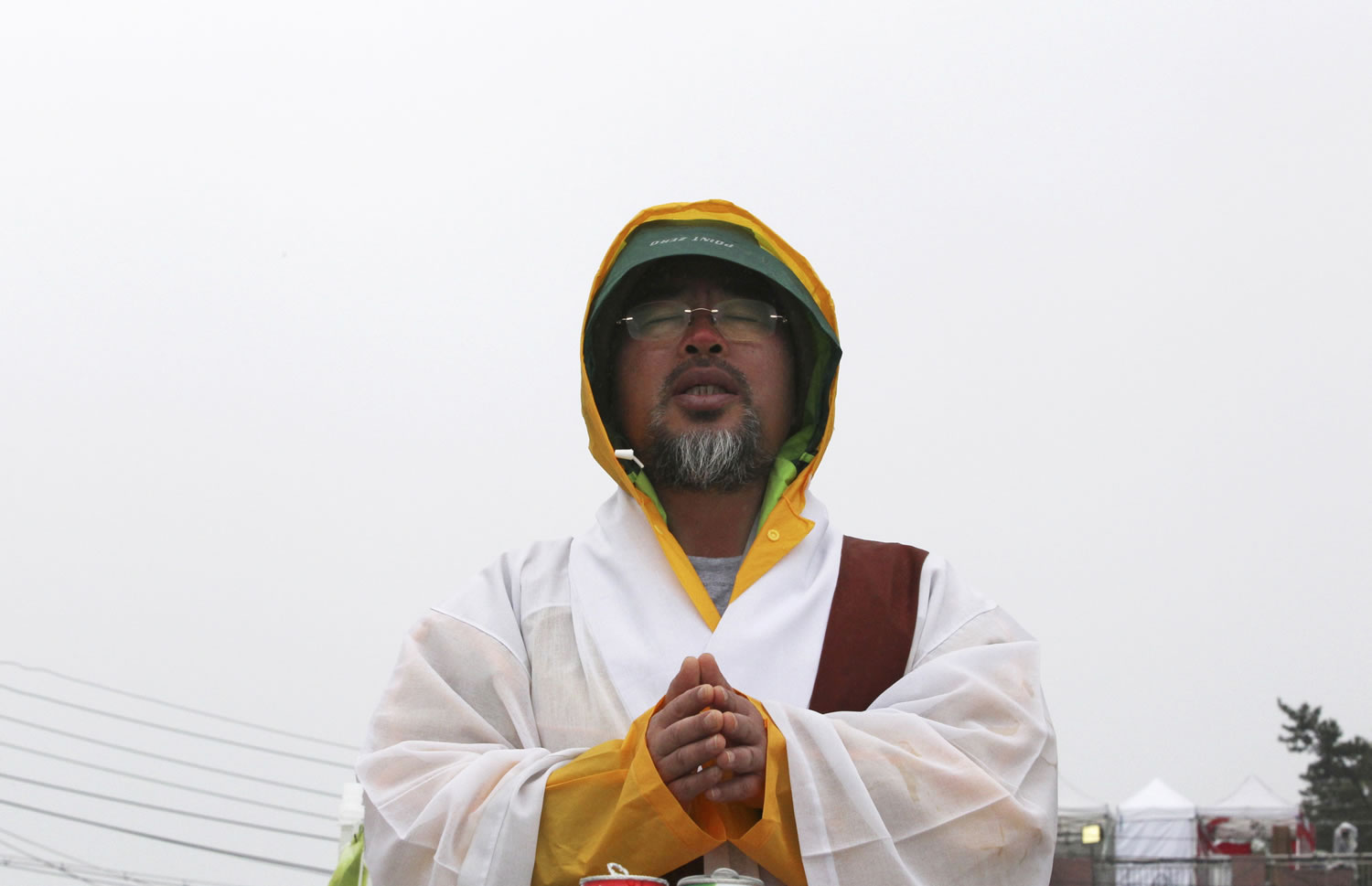 Buddhist monk, Bul Il offers prayers to wish for safe return of passengers of the sunken ferry Sewol in Jindo, South Korea.