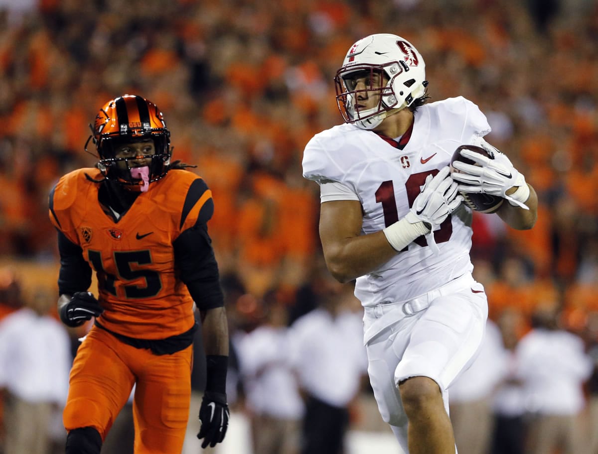 Stanford&#039;s Austin Hooper, right, catches a touchdown pass as Oregon State&#039;s Larry Scott trails during the first half Friday in Corvallis, Ore. (Timothy J.