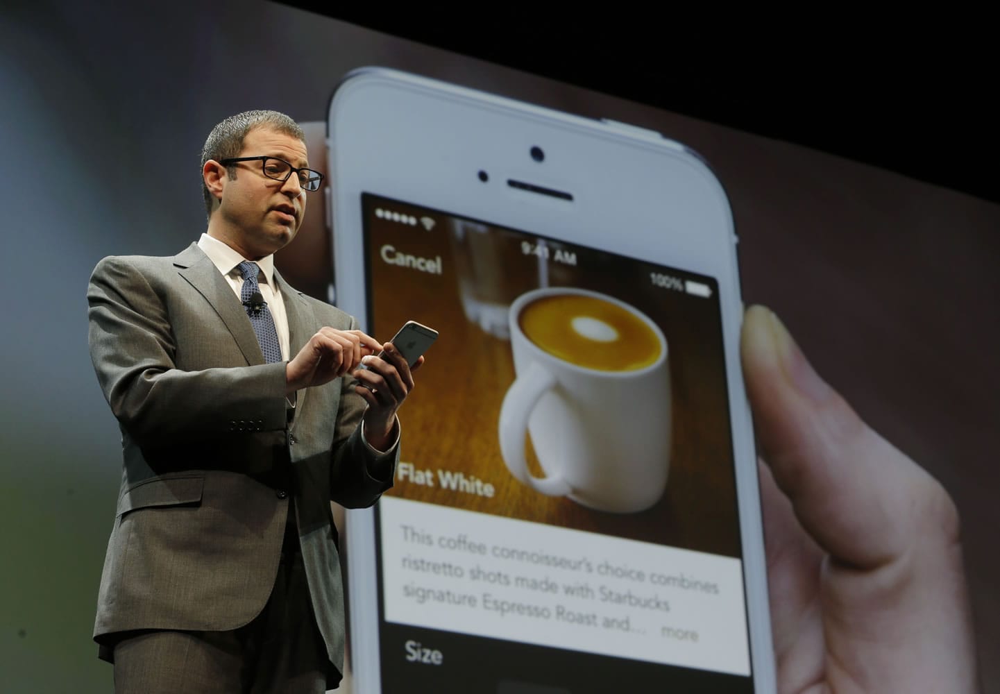 Adam Brotman, Starbucks chief digital officer, talks about the company's new mobile ordering app at Starbucks Coffee Company's annual shareholders meeting in May in Seattle. The Seattle-based coffee chain says its mobile app that lets people order and pay in advance will be available nationally starting Tuesday.