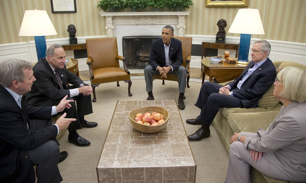 Sen. Dick Durbin, D-Ill., from left, Sen. Charles Schumer, D-N.Y., President Barack Obama, Senate Majority Leader Harry Reid of Nev., Sen.