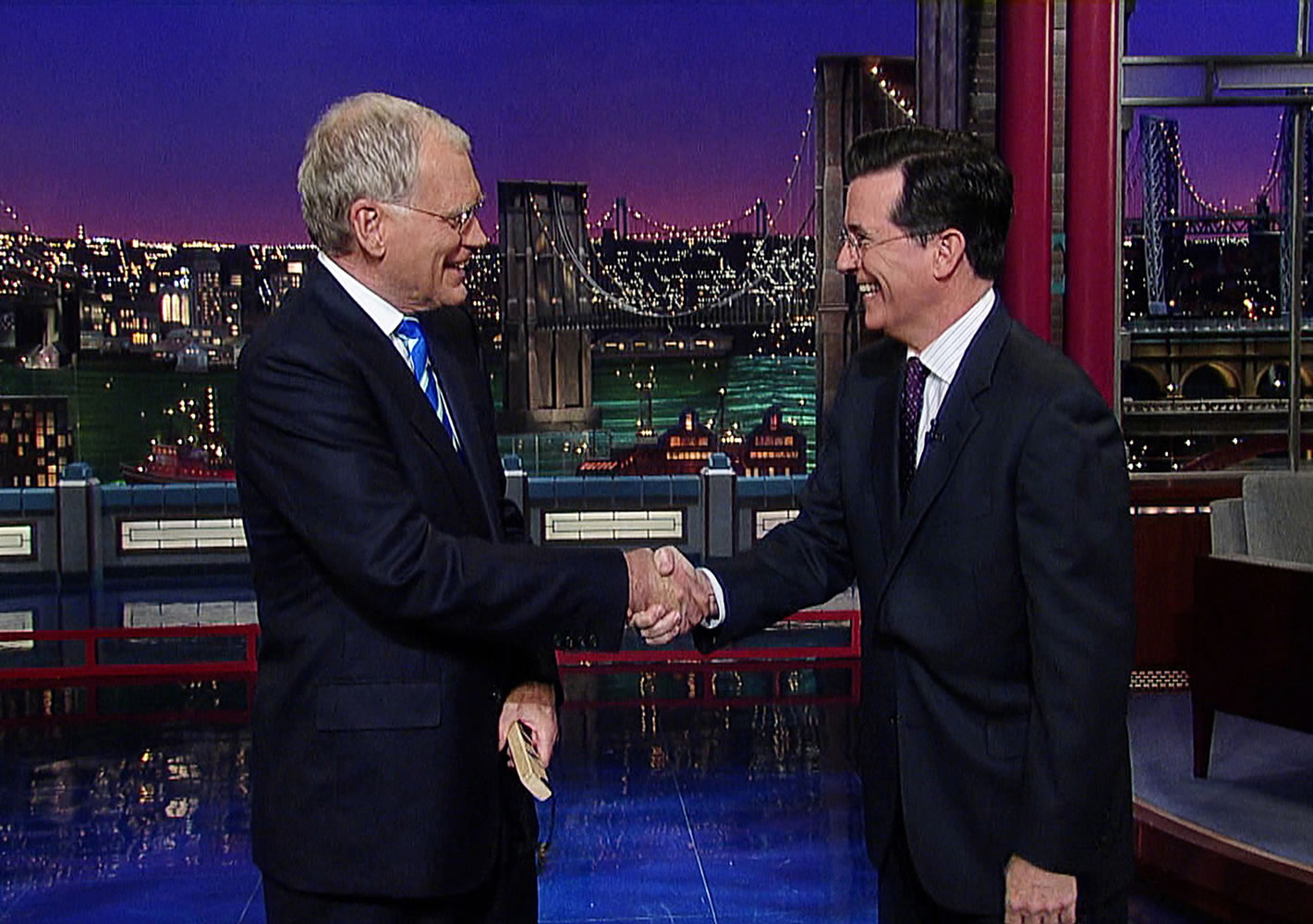 Host David Letterman, left, shaking hands with fellow talk show host Stephen Colbert of &quot;The Colbert Report,&quot; during a surprise visit in 2011 on the &quot;Late Show with David Letterman,&quot; in New York.
