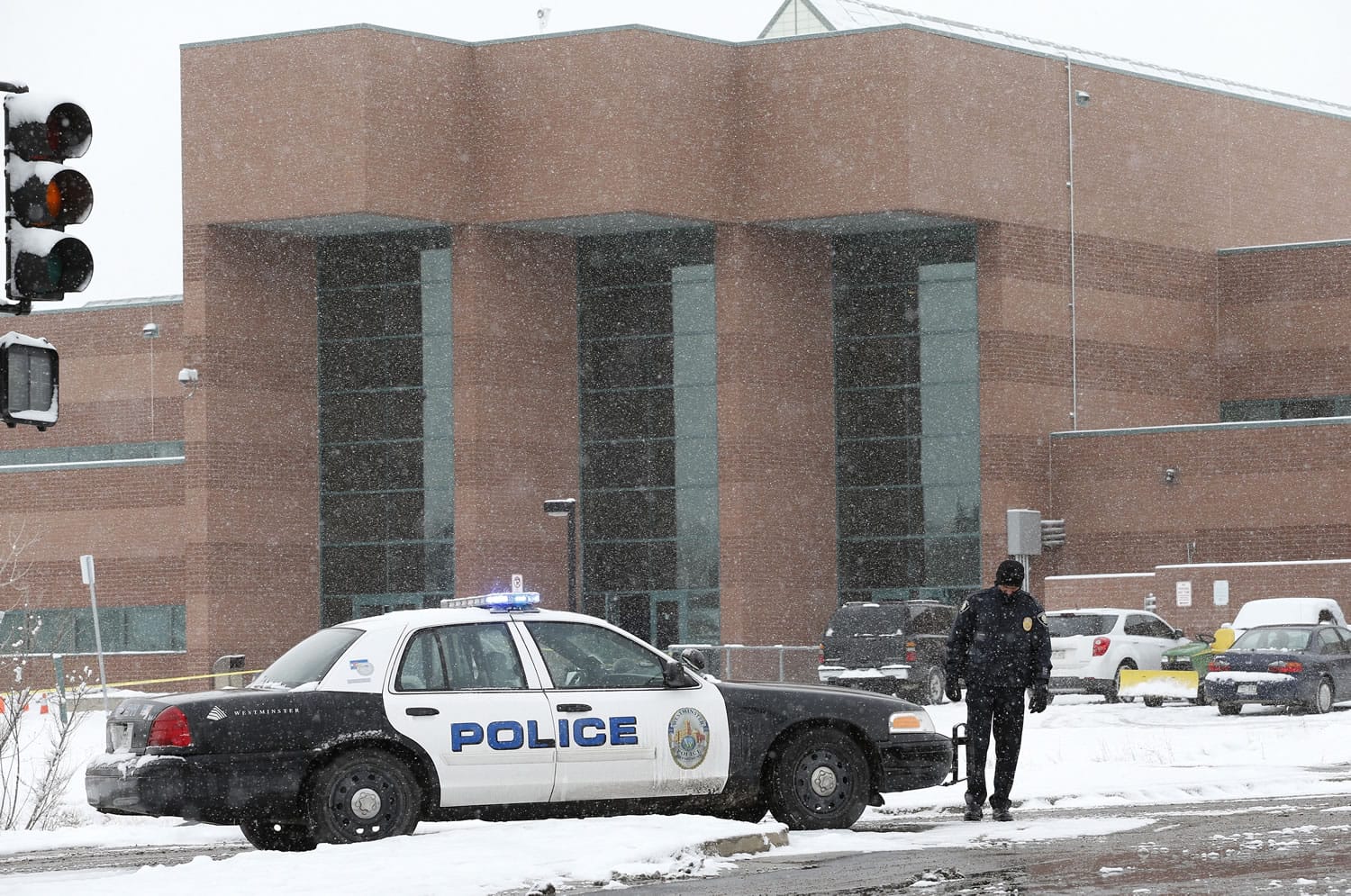 A police cruiser blocks the entrance to Standley Lake High School, where classes were cancelled after an apparent suicide attempt by a student in Westminster, Colo., on Monday.