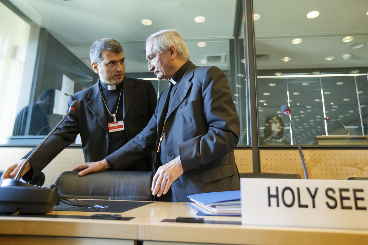 Archbishop Silvano M. Tomasi, right, Apostolic Nuncio, Permanent Observer of the Holy See (Vatican) to the Office of the United Nations in Geneva, speaks with Monsignor Christophe El-Kassis, left, prior the UN torture committee hearing on the Vatican, at the headquarters of the office of the High Commissioner for Human Rights (OHCHR) in the Palais Wilson, in Geneva, Switzerland, Monday, May 5, 2014.