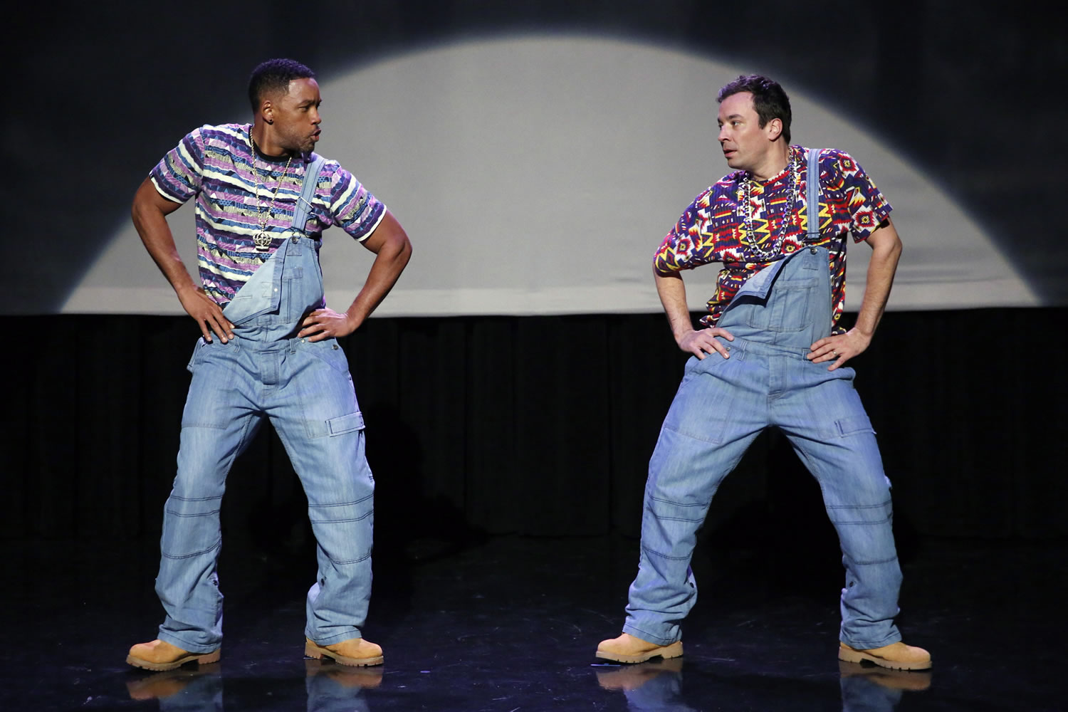 Will Smith, left, and Jimmy Fallon dance out the evolution of hip-hop dancing on the premiere of &quot;The Tonight Show Starring Jimmy Fallon,&quot; in New York.