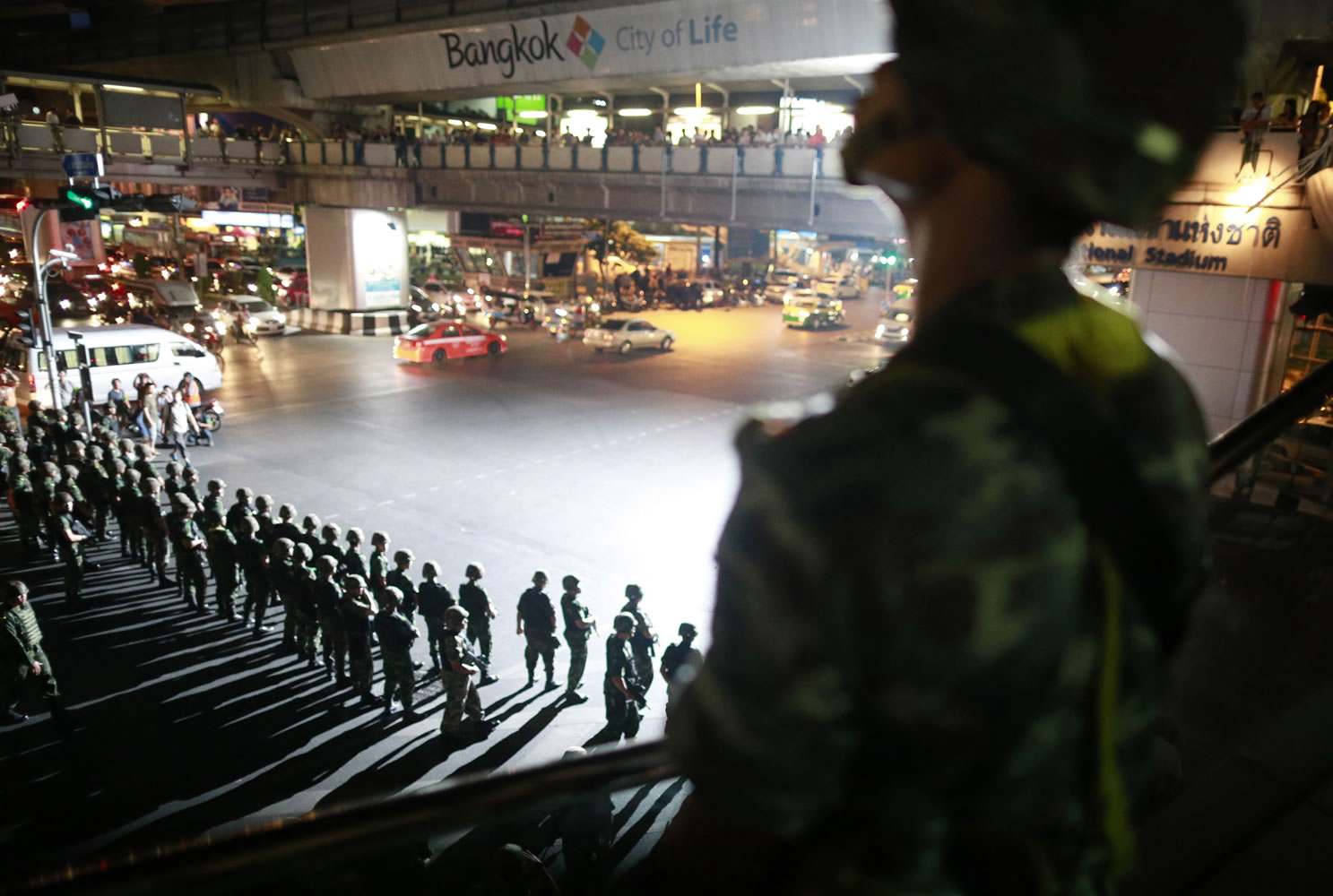 Thai soldiers secure an intersection to prevent protesters from gathering Friday in downtown Bangkok, Thailand.