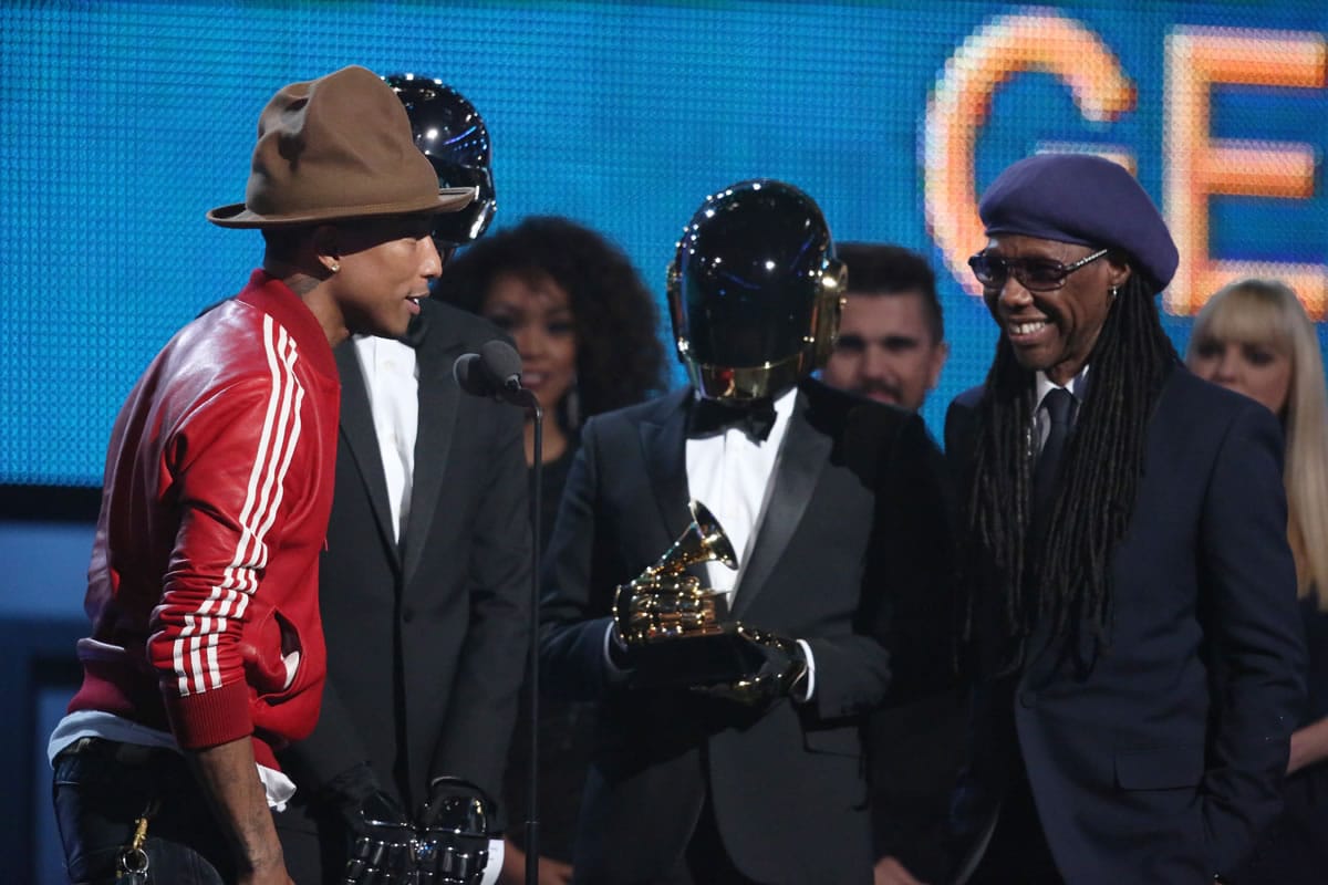 Pharrell Williams, from left, Daft Punk and Nile Rodgers accept the award for best pop duo/group performance at the 56th annual Grammy Awards at Staples Center on Sunday in Los Angeles.