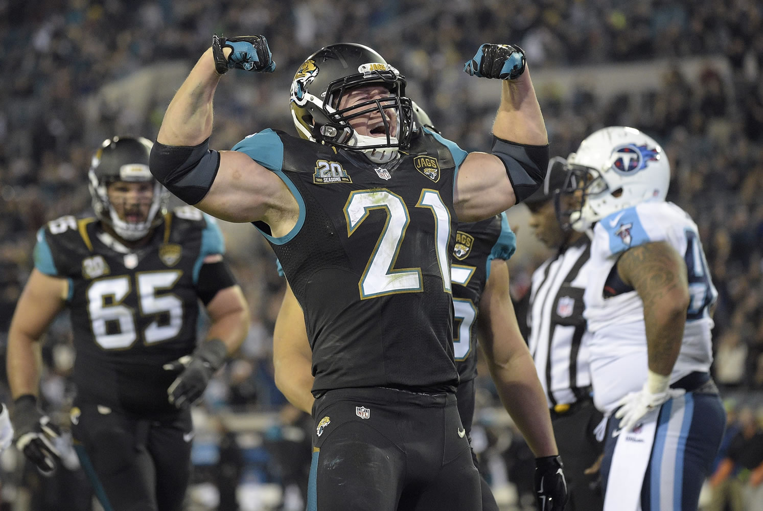 Jacksonville Jaguars running back Toby Gerhart (21) reacts after his 1-yard touchdown run against the Tennessee Titans during the third quarter Thursday, Dec. 18, 2014, in Jacksonville, Fla. (AP Photo/Phelan M.