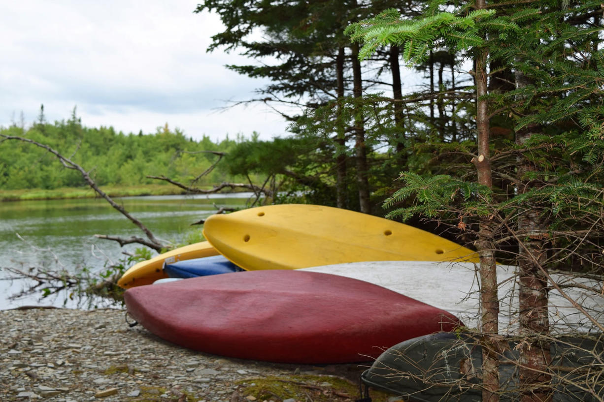 Kayaks and canoes are ready for guests of Trout Point Lodge in Nova Scotia, Canada, to use Aug.