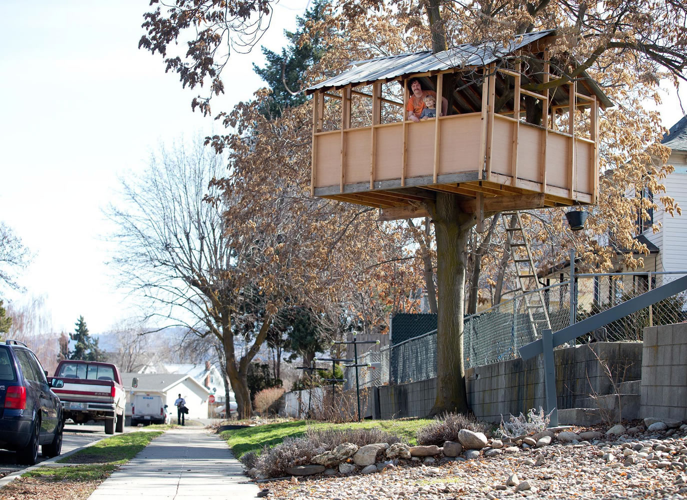 Zeb Postelwait sits in a treehouse outside his home in Wenatchee on March 11.