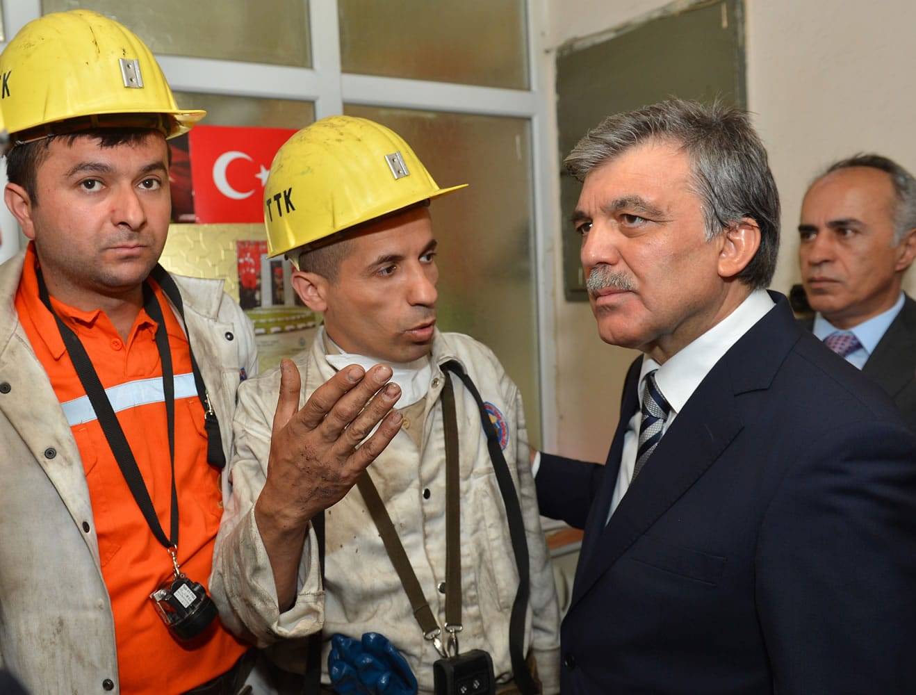 Turkish President Abdullah Gul, right, listens to a miner in Soma, Turkey, on Thursday.