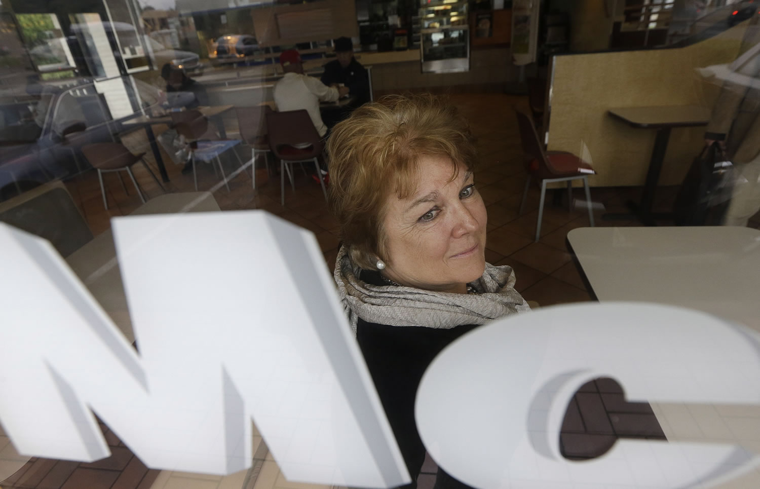 Kathryn Slater-Carter poses for photographs at a McDonald's restaurant she owns in Daly City, Calif.,