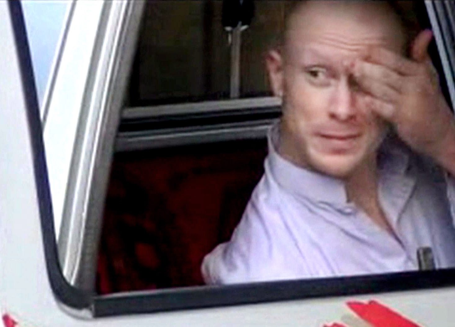 In this image taken from video obtained from Voice Of Jihad Website, which has been authenticated based on its contents and other AP reporting, Sgt. Bowe Bergdahl, sits in a vehicle guarded by the Taliban in eastern Afghanistan. A U.S. defense official says released captive Army Sgt. Bowe Bergdahl is scheduled to arrive at a military medical center in Texas on Friday. The official, who spoke Thursday on condition of anonymity because the plan has not been publicly announced, declined to provide details. Officials had previously said the intention was for Bergdahl to be reunited with his family at Brooke Army Medical Center in San Antonio.