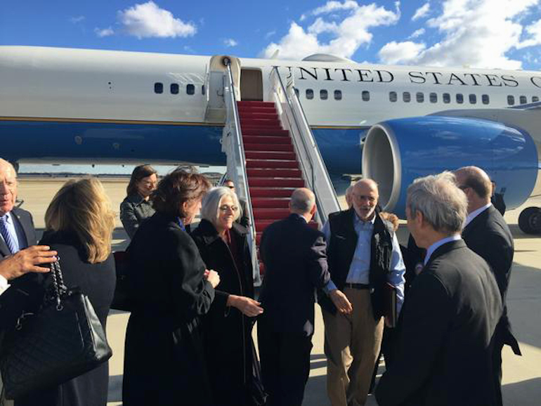 This handout photo from the Twitter account of Sen. Jeff Flake, R-Ariz. shows Alan Gross arriving at Andrews Air Force Base, Md., Wednesday. The US and Cuba have agreed to re-establish diplomatic relations and open economic and travel ties, marking a historic shift in U.S. policy toward the communist island after a half-century of enmity dating back to the Cold War, American officials said Wednesday. The announcement came amid a series of sudden confidence-building measures between the longtime foes, including the release of American prisoner Alan Gross, as well as a swap for a U.S. intelligence asset held in Cuba and the freeing of three Cubans jailed in the U.S. Gross' wife Judy is at center. (AP Photo/Sen.