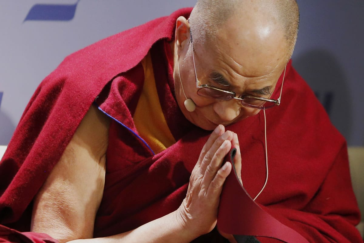 Tibetan spiritual leader the Dalai Lama acknowledges the audience before speaking at an event titled: &quot;Happiness, Free Enterprise, and Human Flourishing&quot; Thursday at the American Enterprise Institute in Washington.