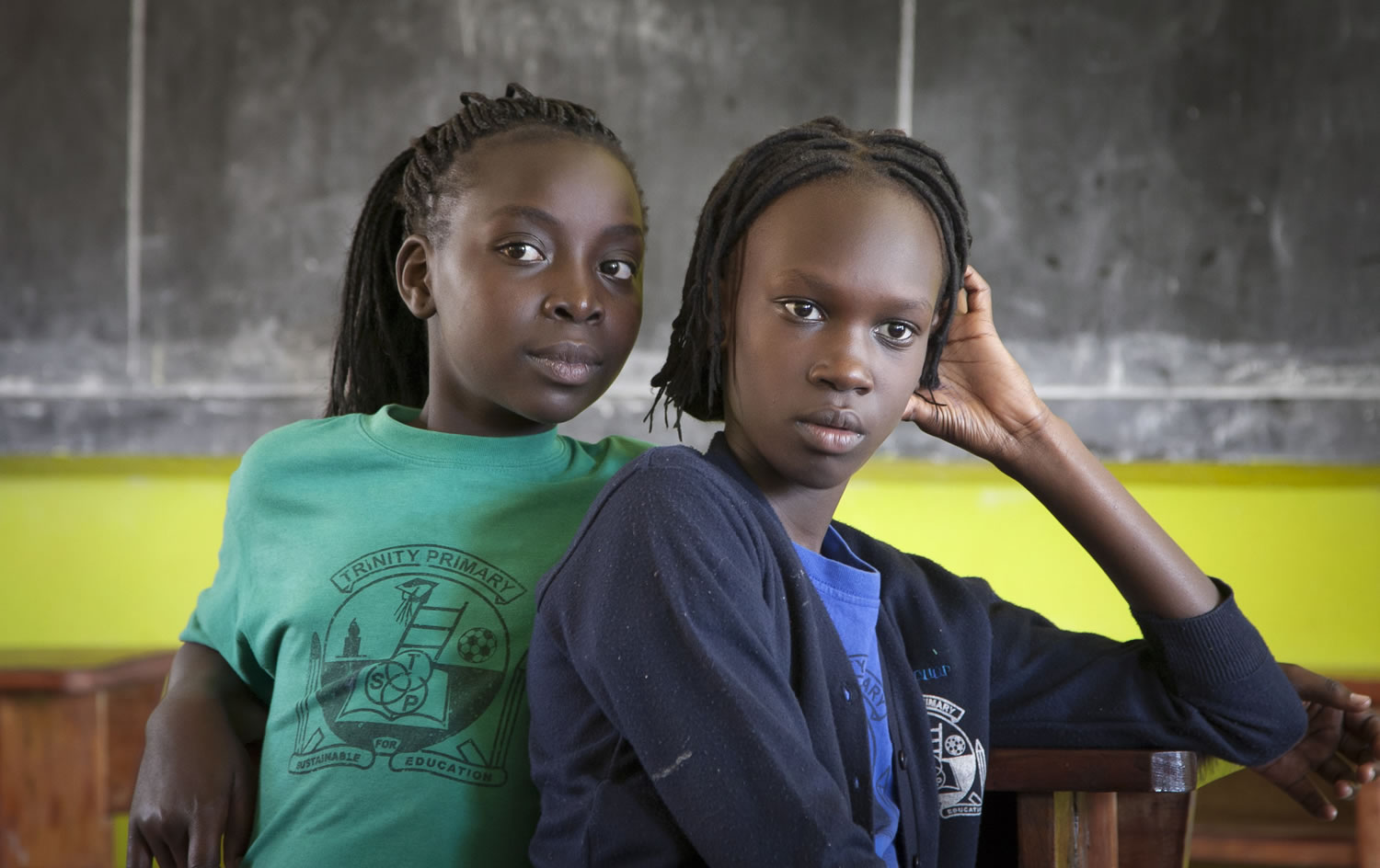 Two South Sudanese teenagers, who previously lived in Israel, listen to their friends reminisce about their time in Tel Aviv&gt; They now live at the Trinity boarding school in Kampala, Uganda.