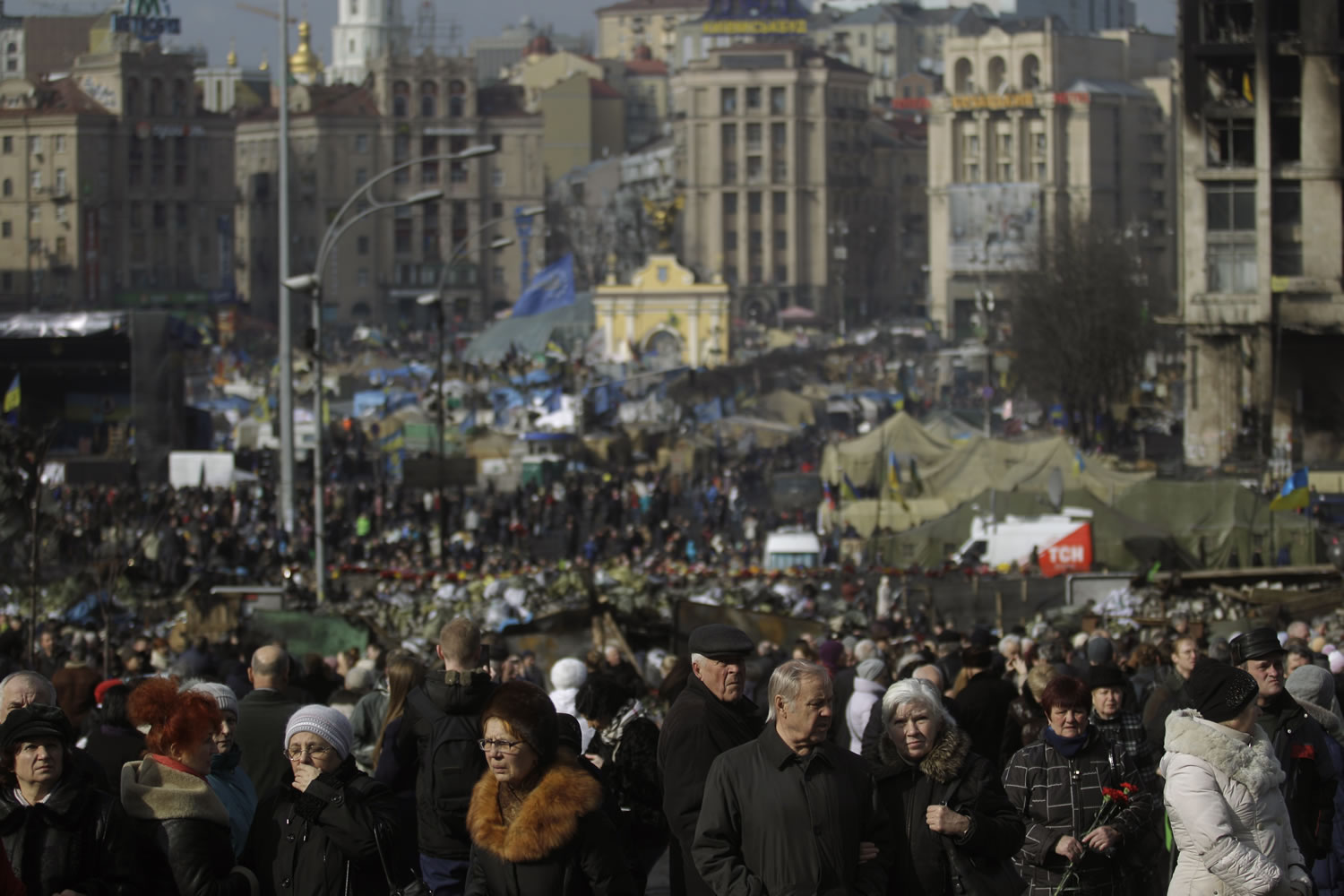 People flock to the Independence Square in Kiev, Ukraine, on Monday.
