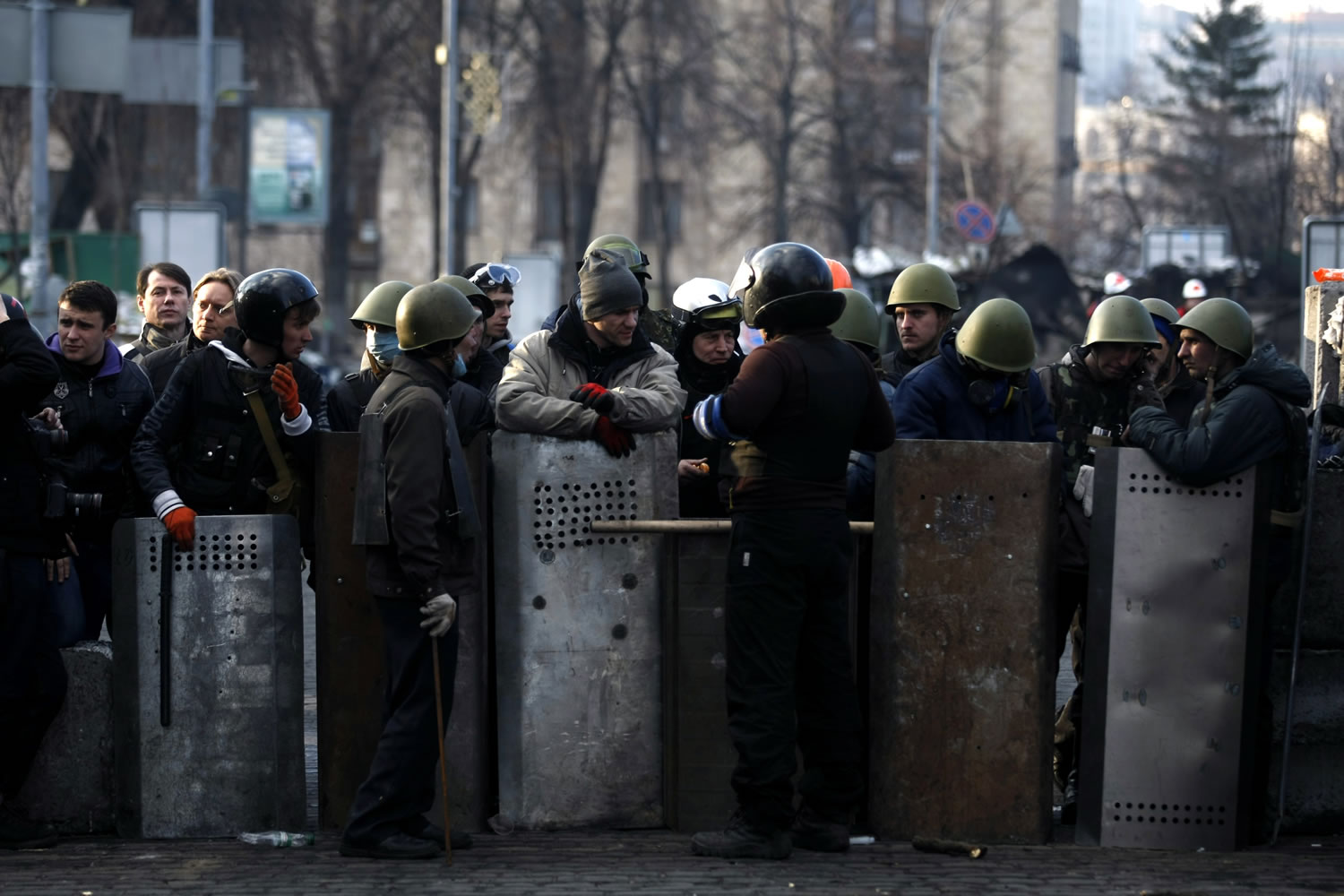 Anti-government protesters man a barricade Friday on the outskirts of Independence Square in Kiev, Ukraine.