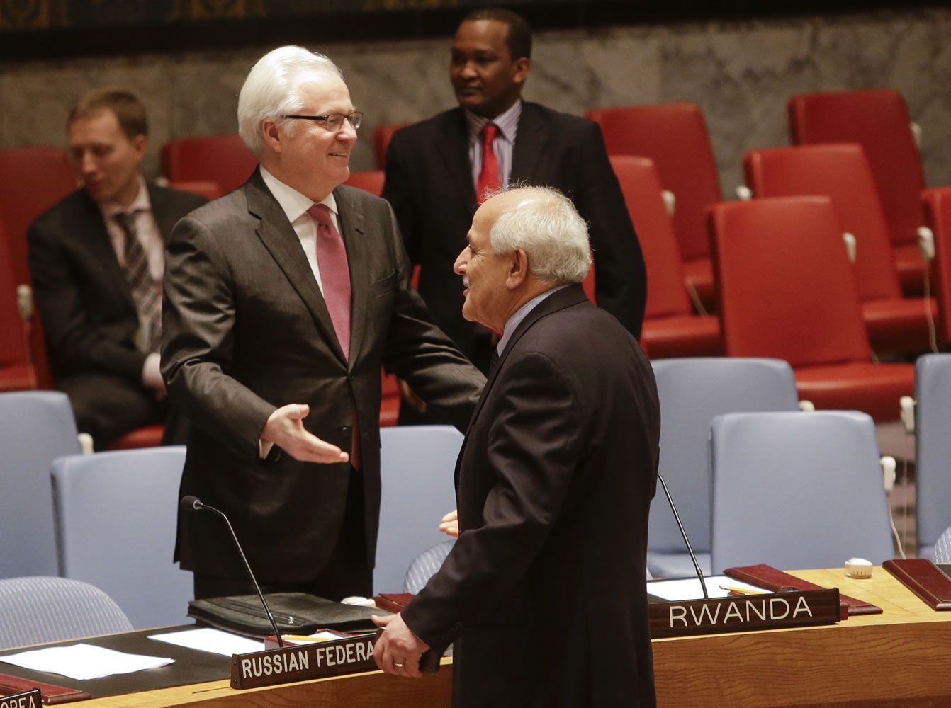 Palestinian Ambassador to the United Nations Riyad Mansour speaks to Russian Foreign Minister Russian Ambassador Vitaly Churkin before a meeting of the U.N.