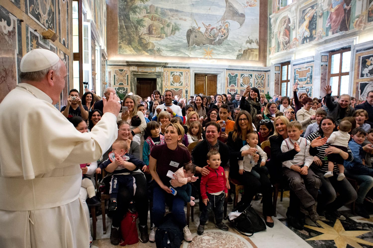 In this photo released by Vatican newspaper L'Osservatore Romano, Pope Francis delivers his blessing Friday during a meeting with the Italian pro-life movement at the Vatican.