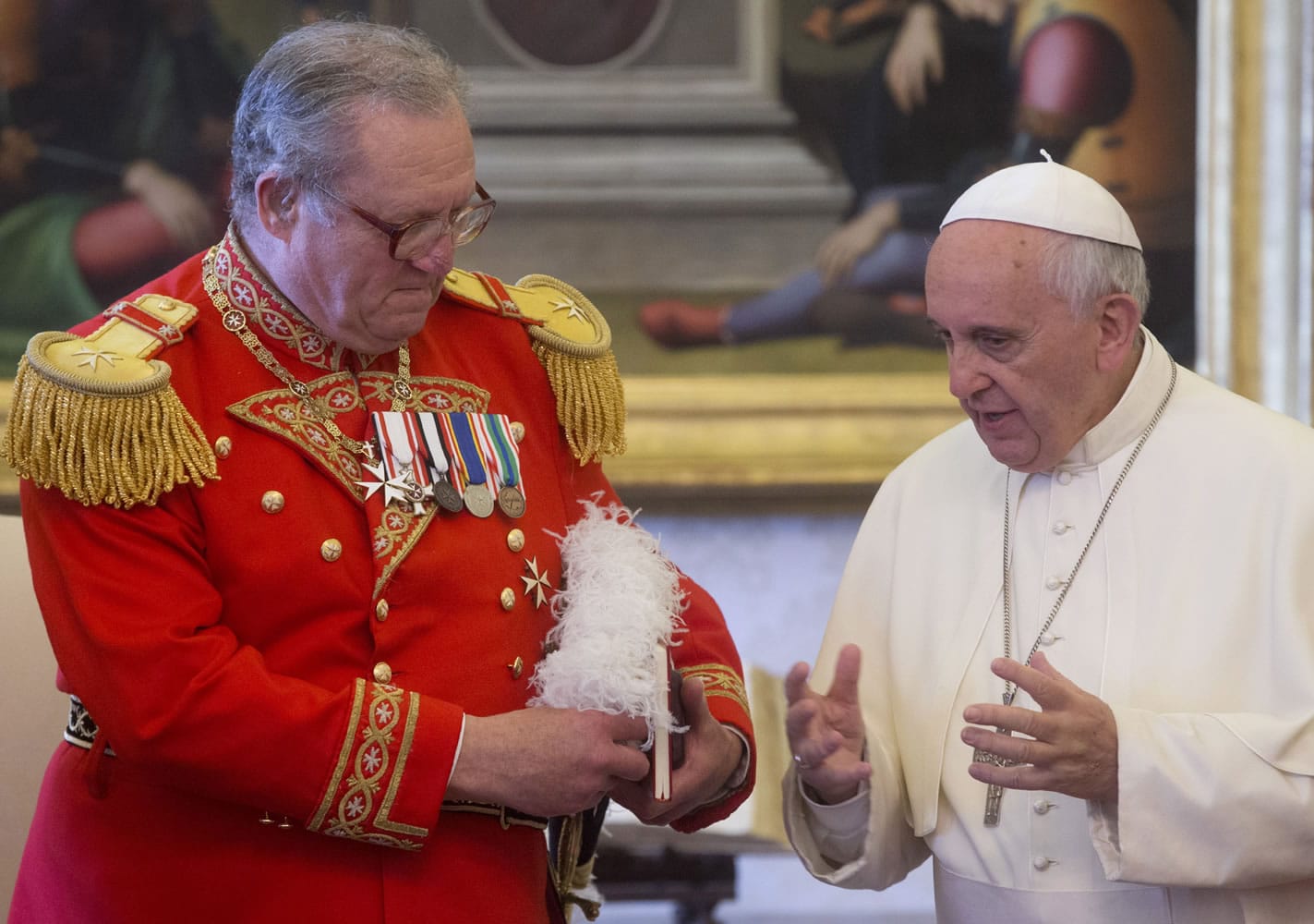 Pope Francis meets the Grand Master of the Sovereign Order of Malta, Fra' Matthew Festing, during a private audience in the pontiff's private library Friday at the Vatican.