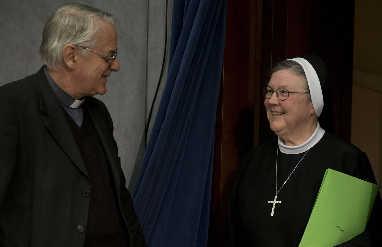 Vatican spokesperson, Father Federico Lombardi, left, greets Mother Mary Clare Millea prior to the start of a press conference at the Vatican on Tuesday.