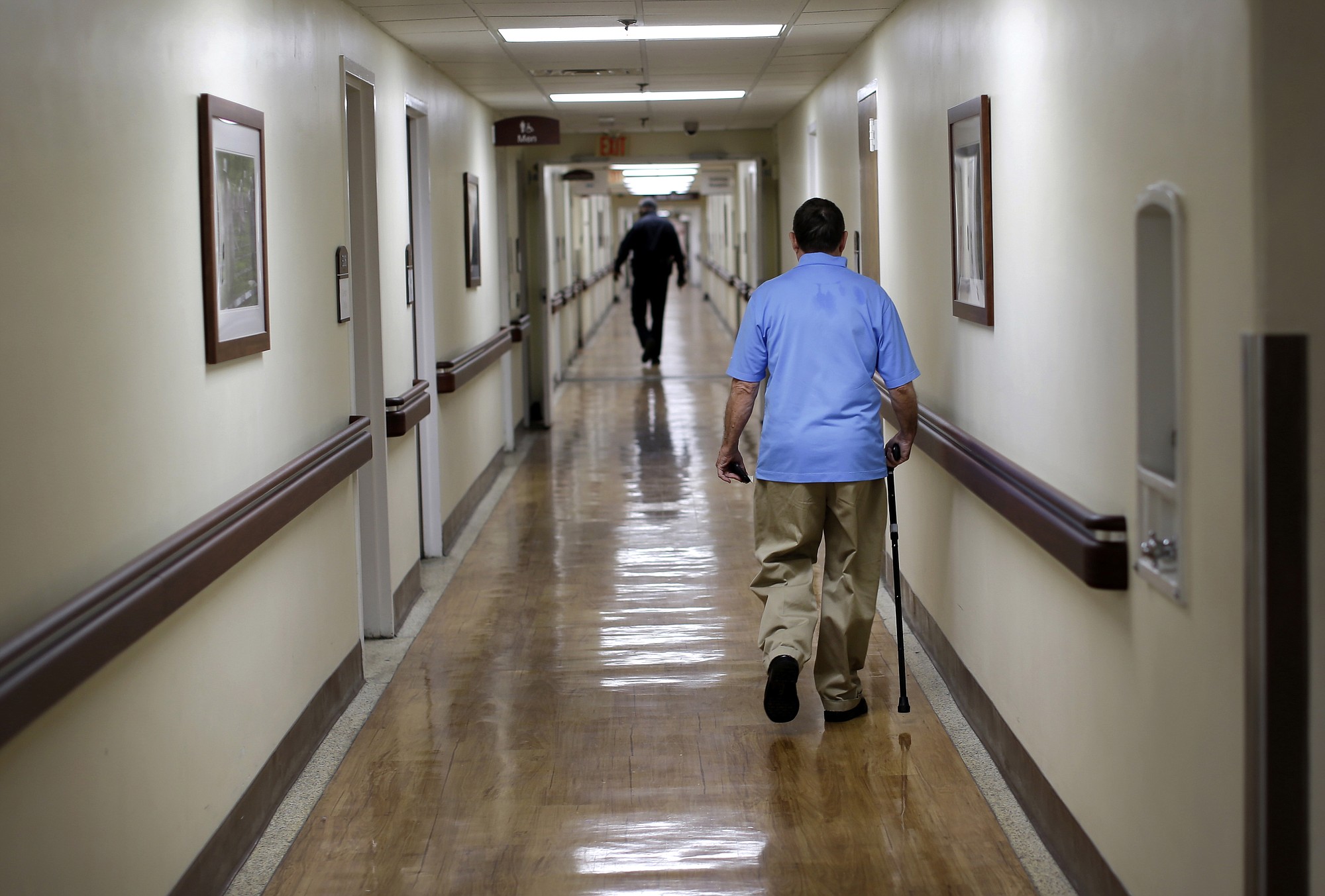 Associated Press files
A patient walks down a hall at the Fayetteville Veterans Affairs Medical Center last month in Fayetteville, N.C. It is one of the most backed-up facilities in the nation.