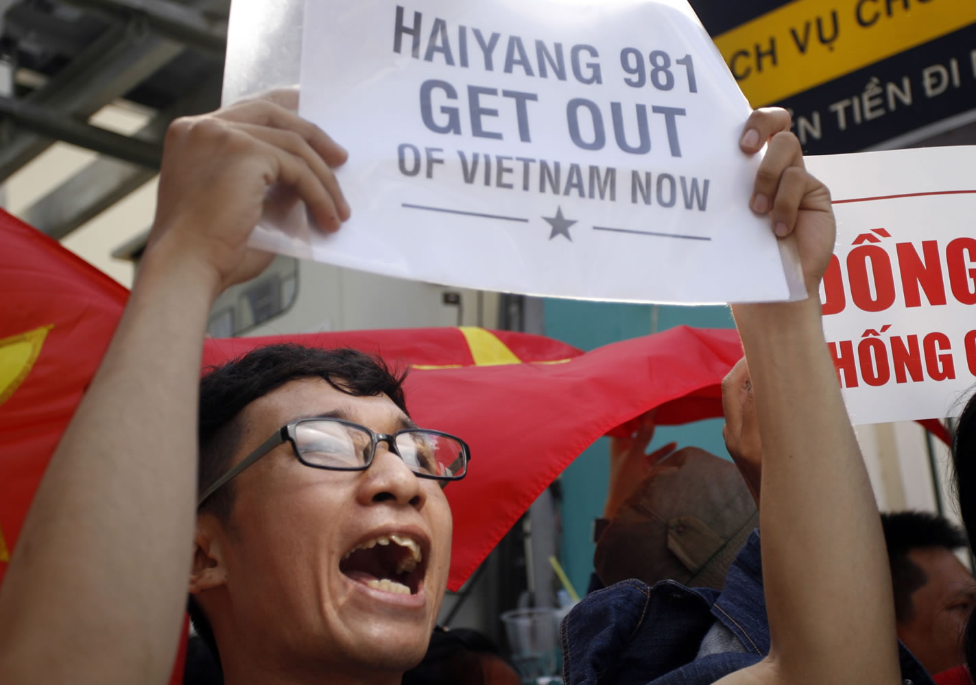 Associated Press
A Vietnamese protester shouts Saturday during a protest rally against China outside the Chinese Consulate in Ho Chi Minh City, Vietnam.