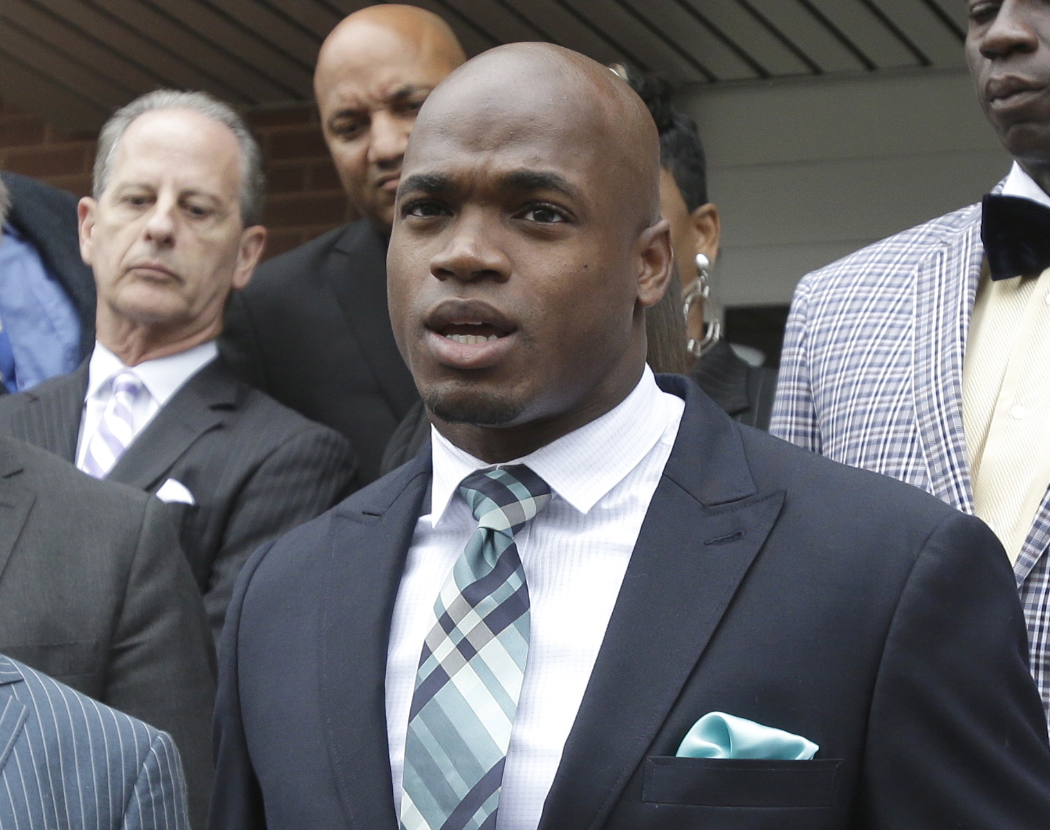 Minnesota Vikings running back Adrian Peterson speaks to the media after pleading no contest to an assault charge in Conroe, Texas, in NOvember.